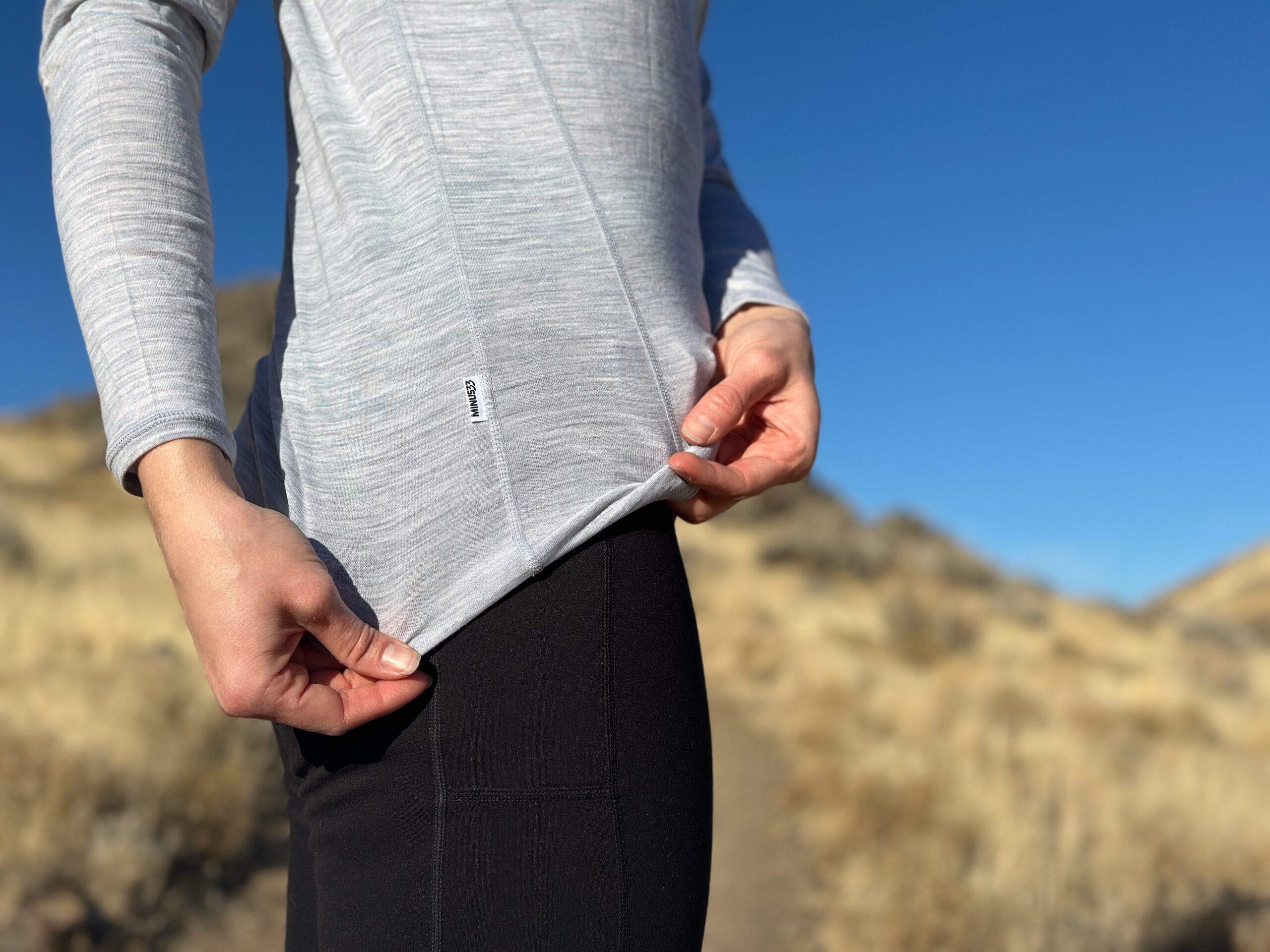 woman hiking with backpacking pack on through high desert