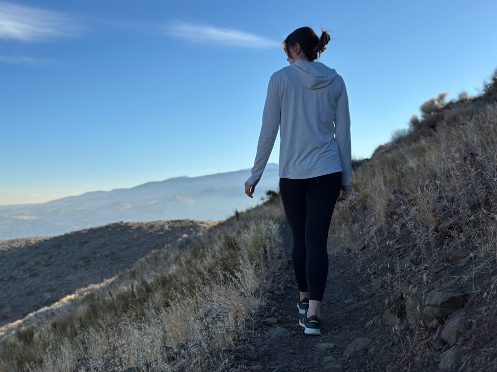 woman hiking and running through high desert