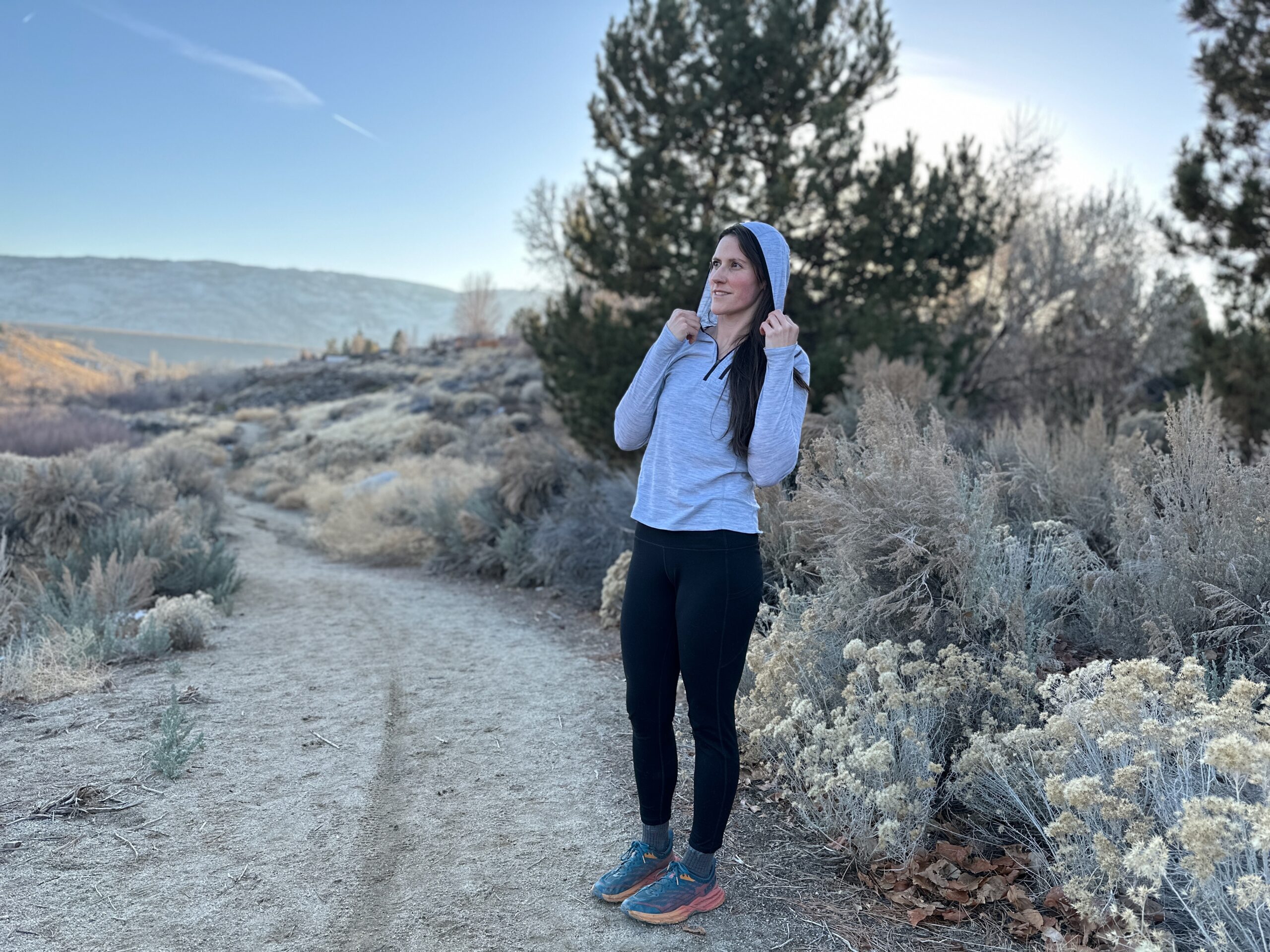 woman hiking around high desert plants 