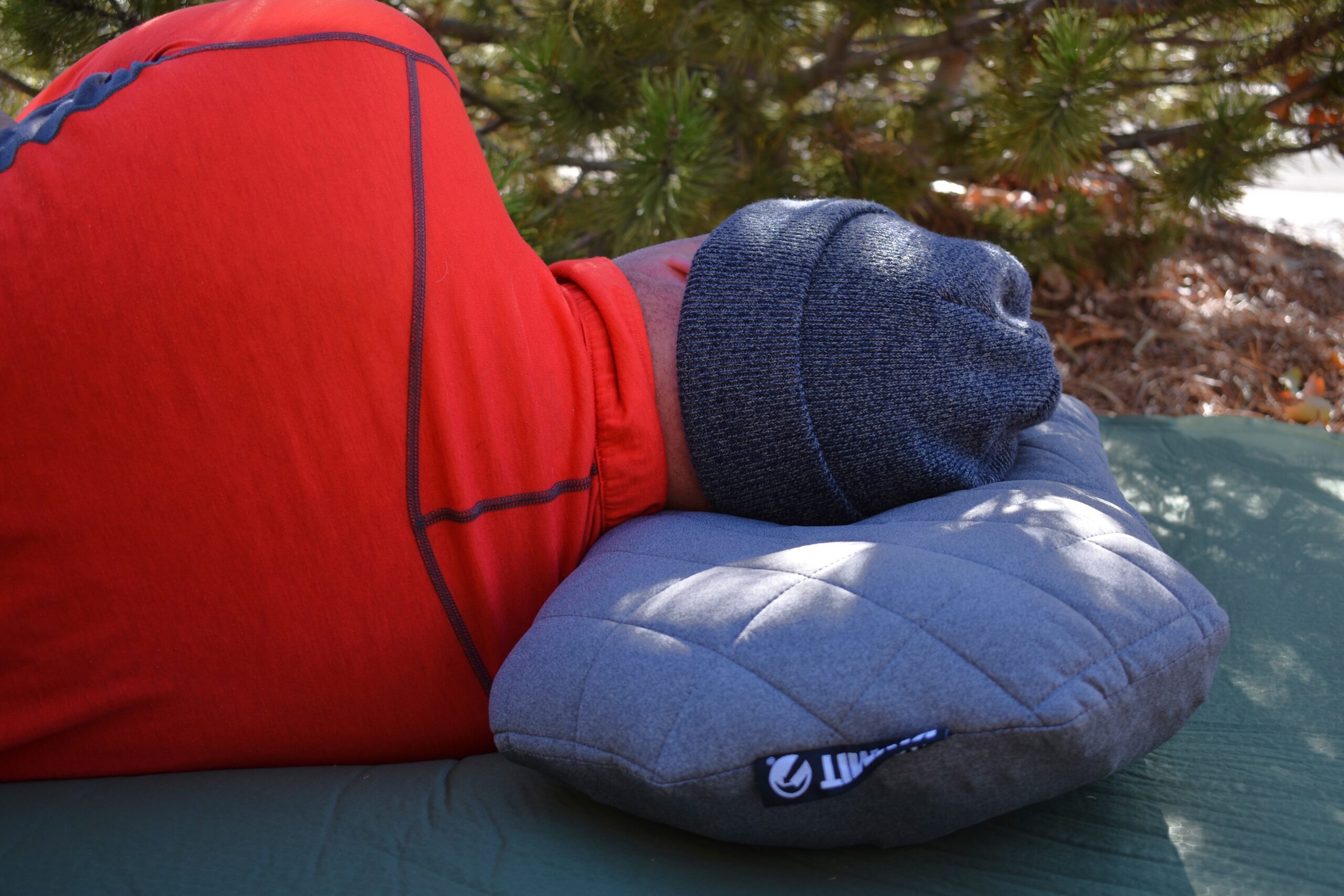 Close up of our gear analyst's neck, which is aligned while sleeping on his side on the Klymit LUXE Pillow