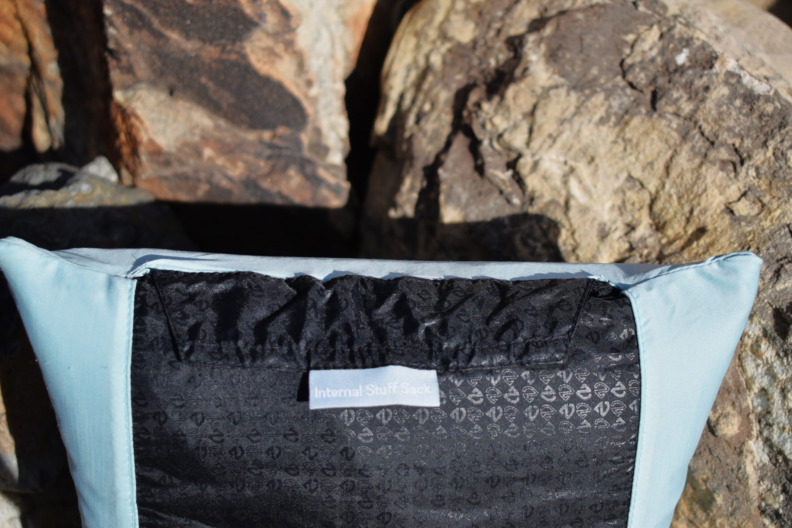 Close up of the pouch that holds the Fillo pillow's integrated stuff sack