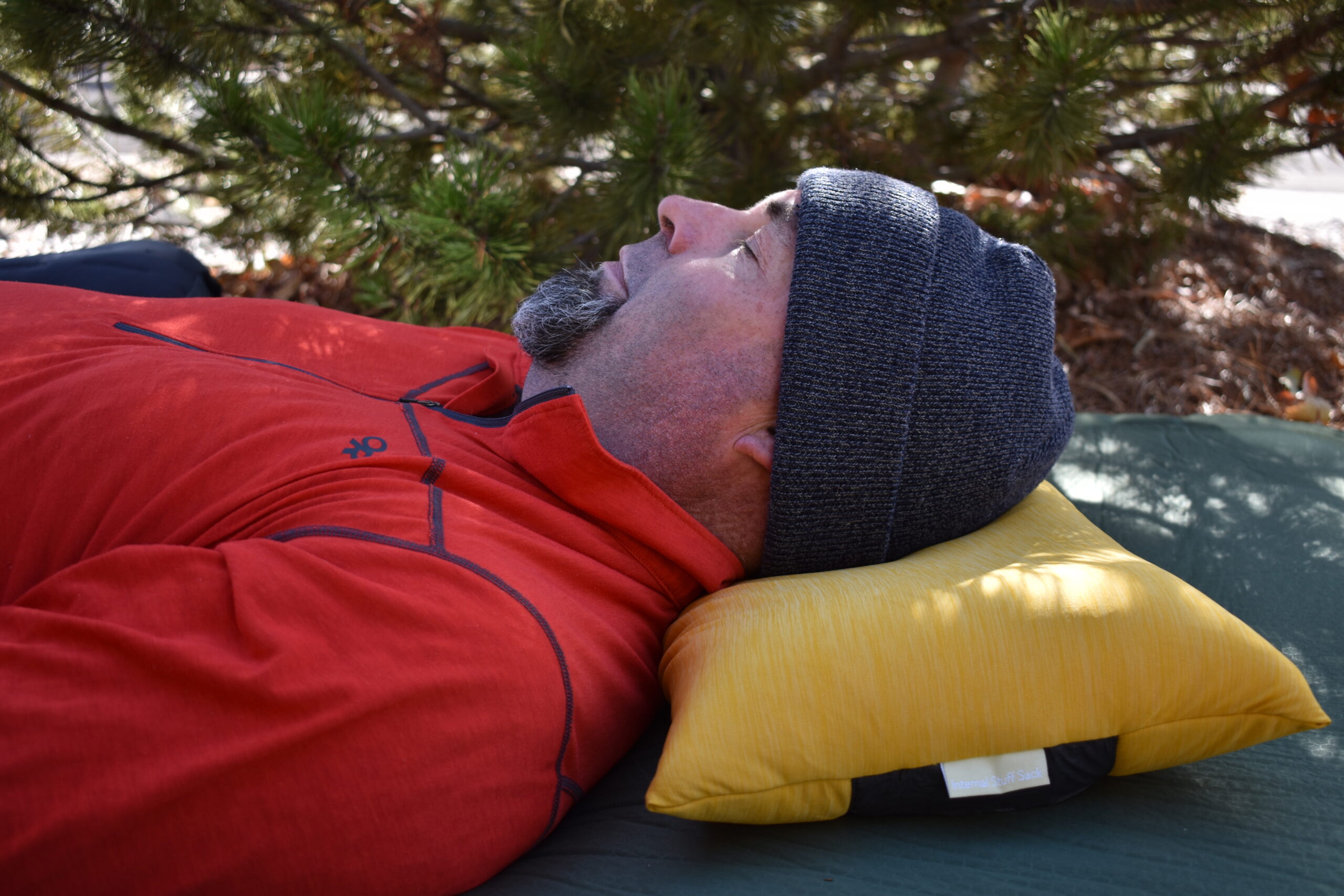 The author laying on his back with his head comfortably supported by the Fillo Elite Luxury pillow