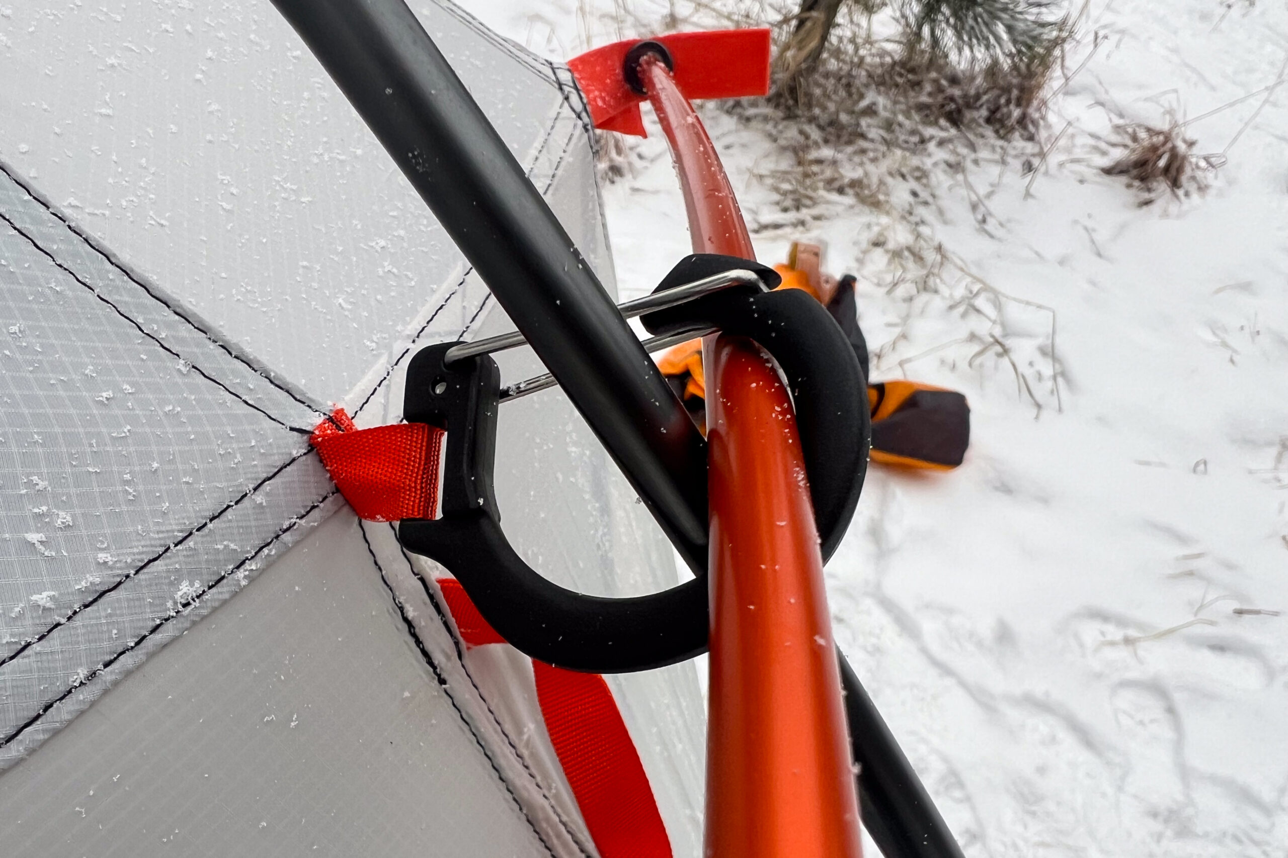 Close-up of the Nemo Kunai 2’s pole intersection system, showing durable clips and fabric reinforcements.