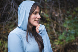 Hiker looking at friend during conversation