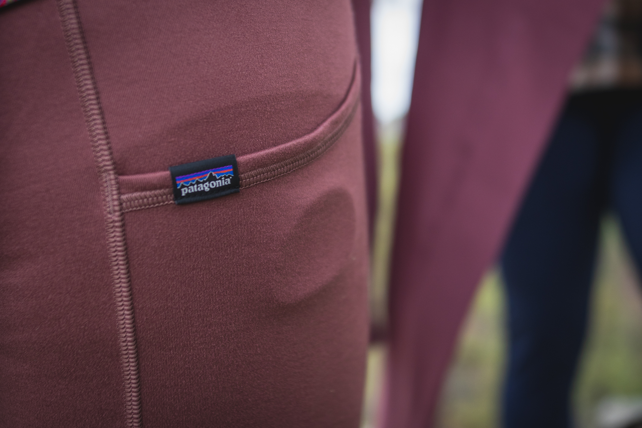 close up of a Patagonia Logo on a pair of pastel pink leggings