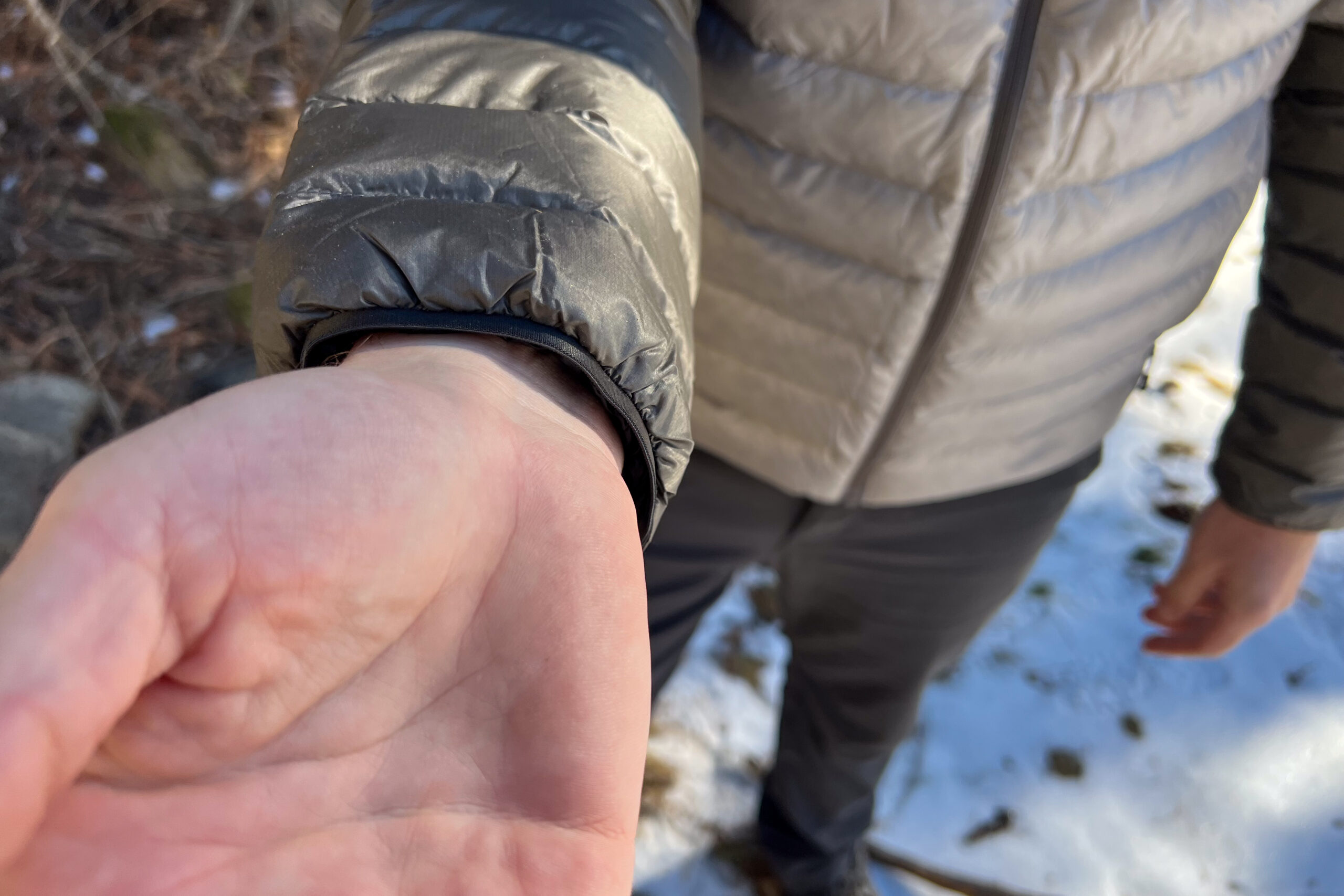 Close-up of the elastic cuff on the REI Magma 850 Down Hoody, highlighting its basic design and snug fit.