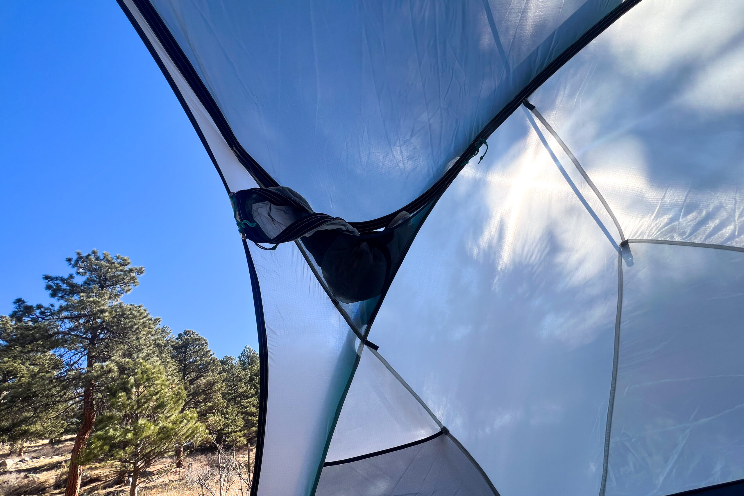 an inside view of a tent showing the door packed into a mesh pocket.