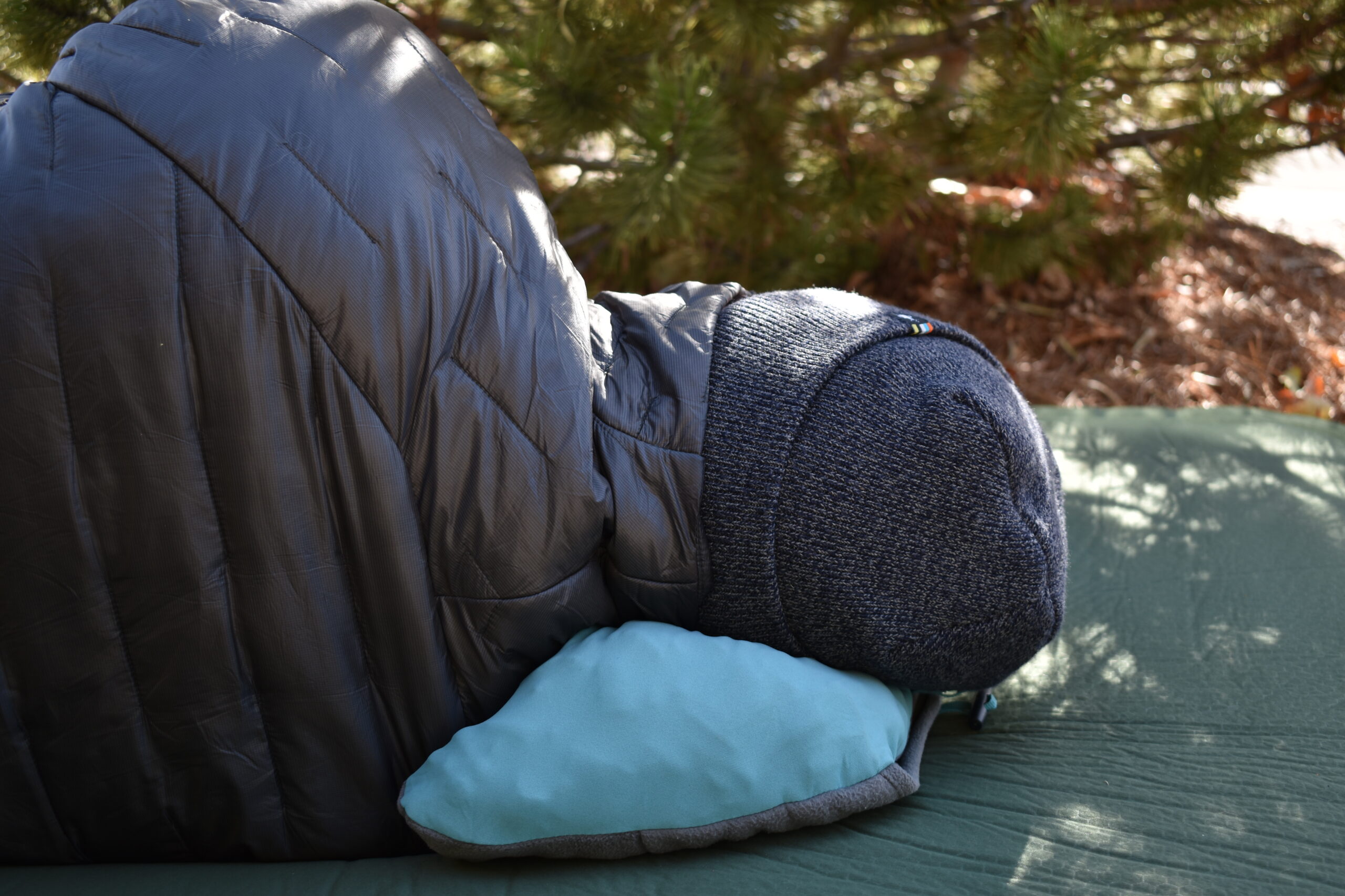 The author's head and neck are not aligned while resting on the REI Trailmade Mummy Bag Pillow