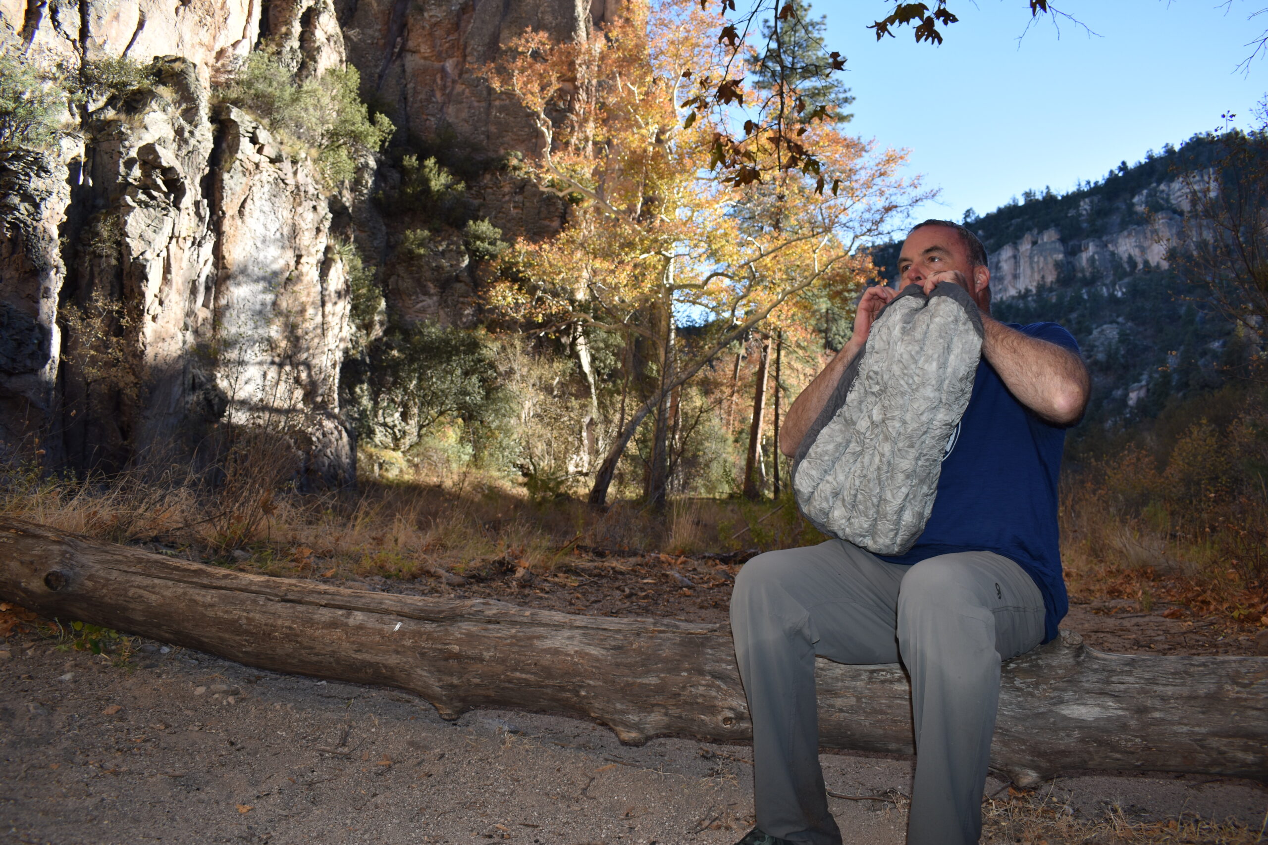 The author inflating the Aeros Down Deluxe pillow while backpacking in the Gila Wilderness