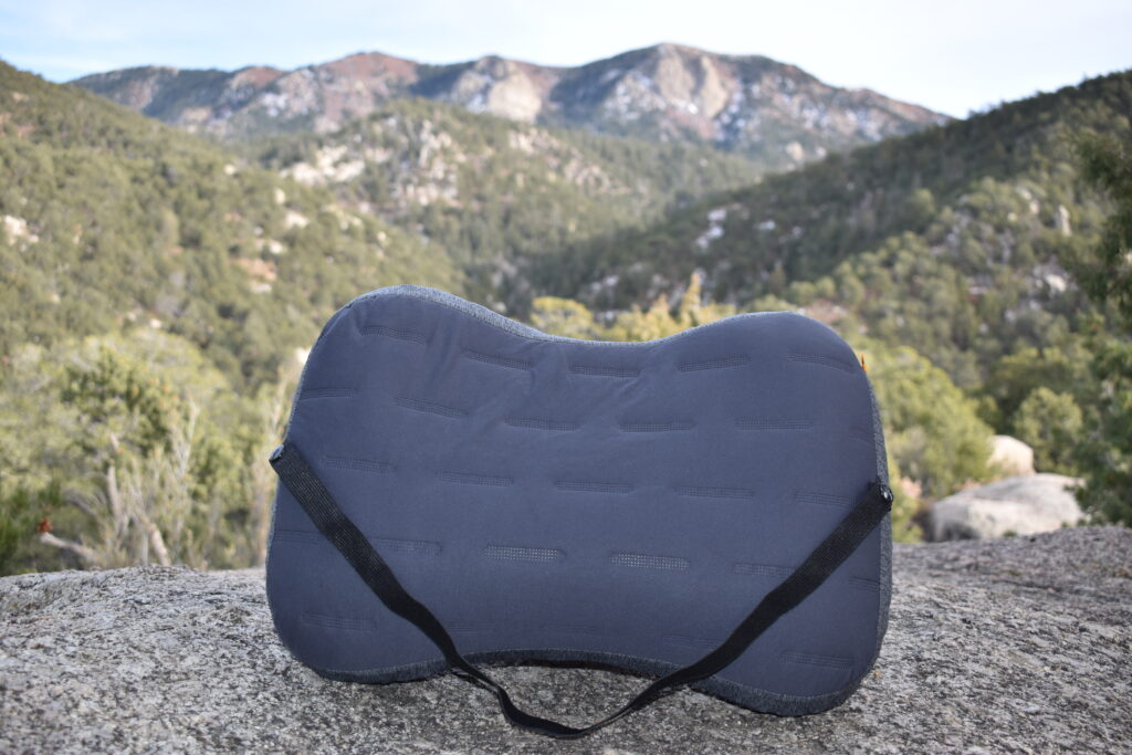 Close up of Trekology Aluft Pro pillow with mountains in the background