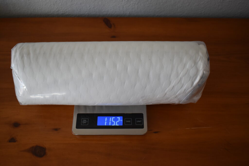 The Weekender Gel Memory Foam pillow sets on a scale that displays a weight of 1 lb 15.2 oz