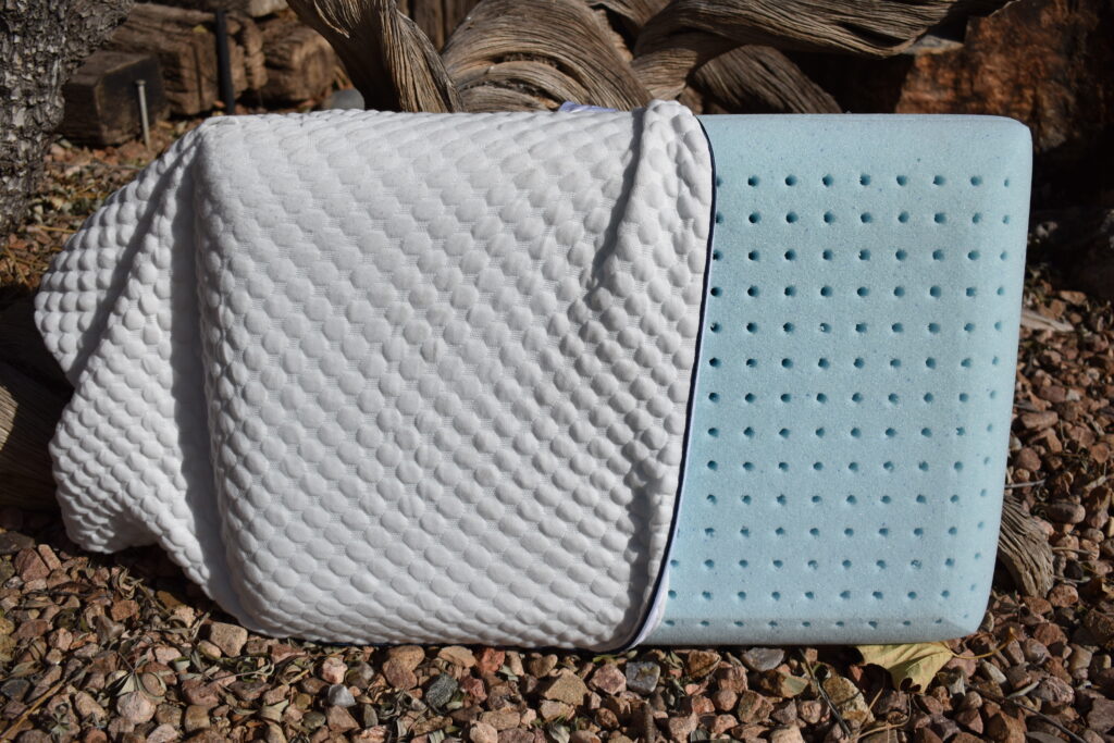 The cushioned cover of the Weekender Gel Memory foam pillow is partially pulled off to reveal the pillow's solid block of gel memory foam