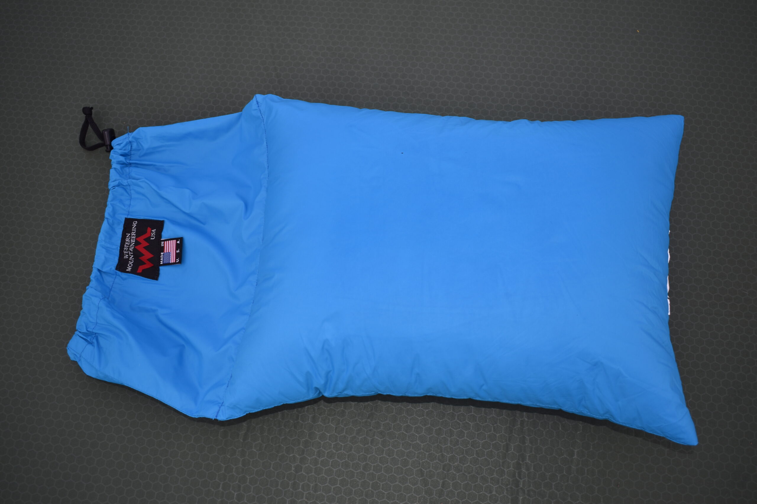 Close up of the Western Mountaineering Cloudrest pillow with its integrated stuff sack