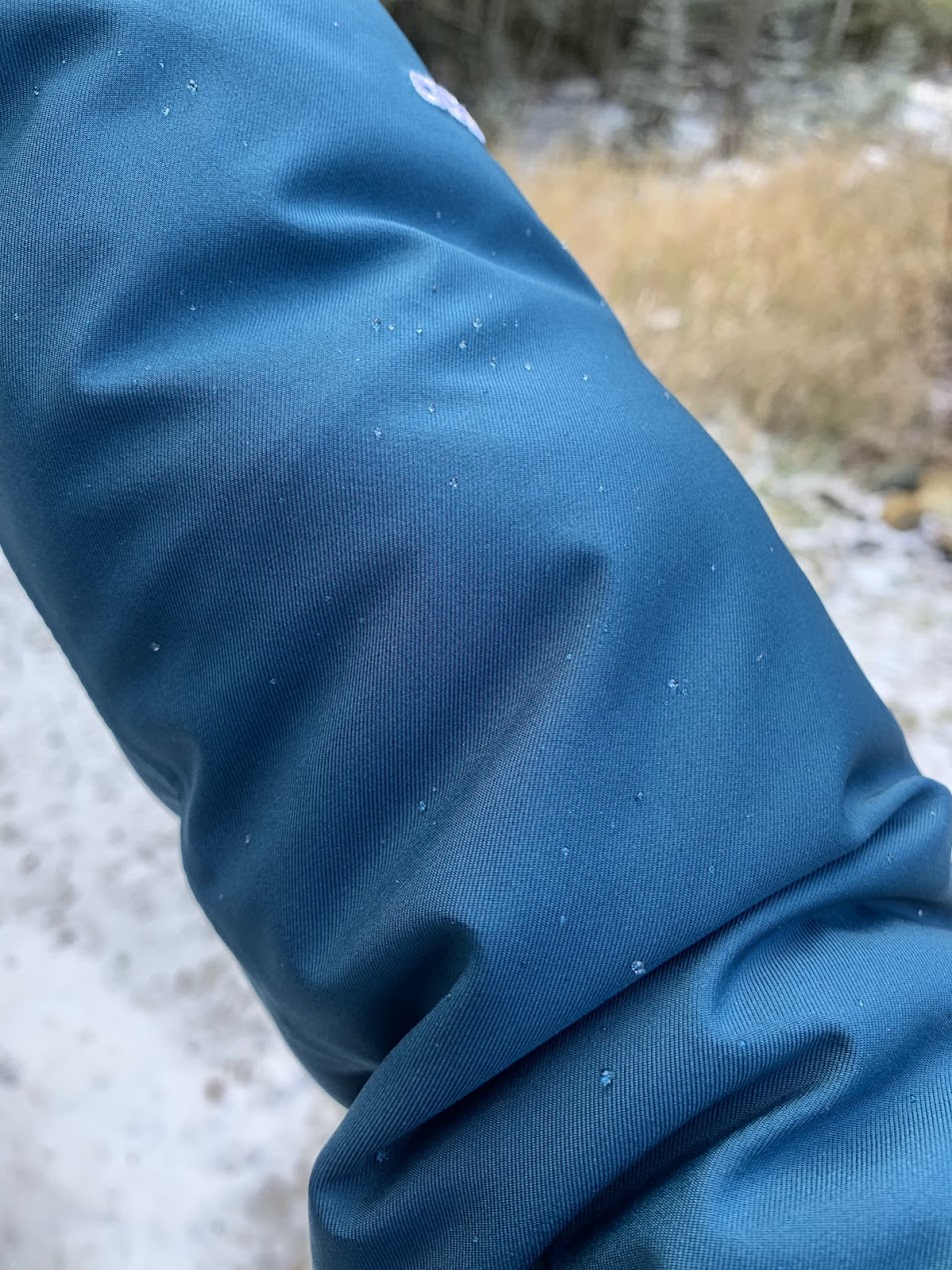 droplets forming on the arm of the north face arctic waterproof winter jacket