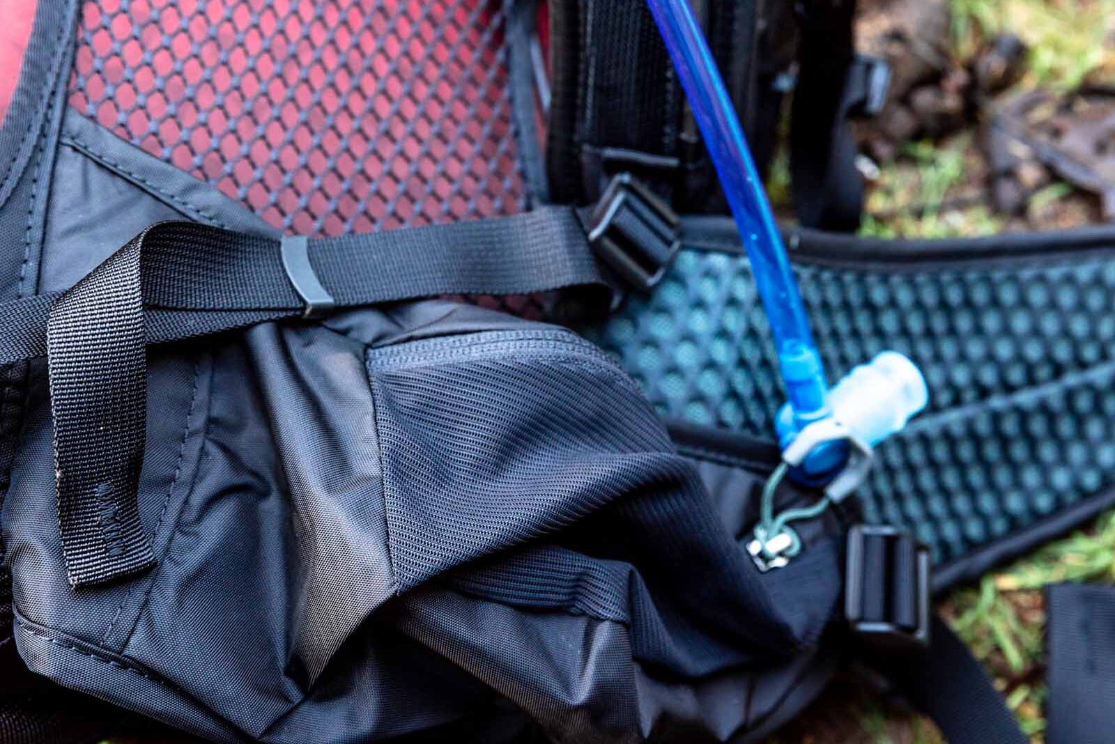 Details of Gregory Sula 16 H2O - a view of the hip belt and the hydration hose with the pack on the ground