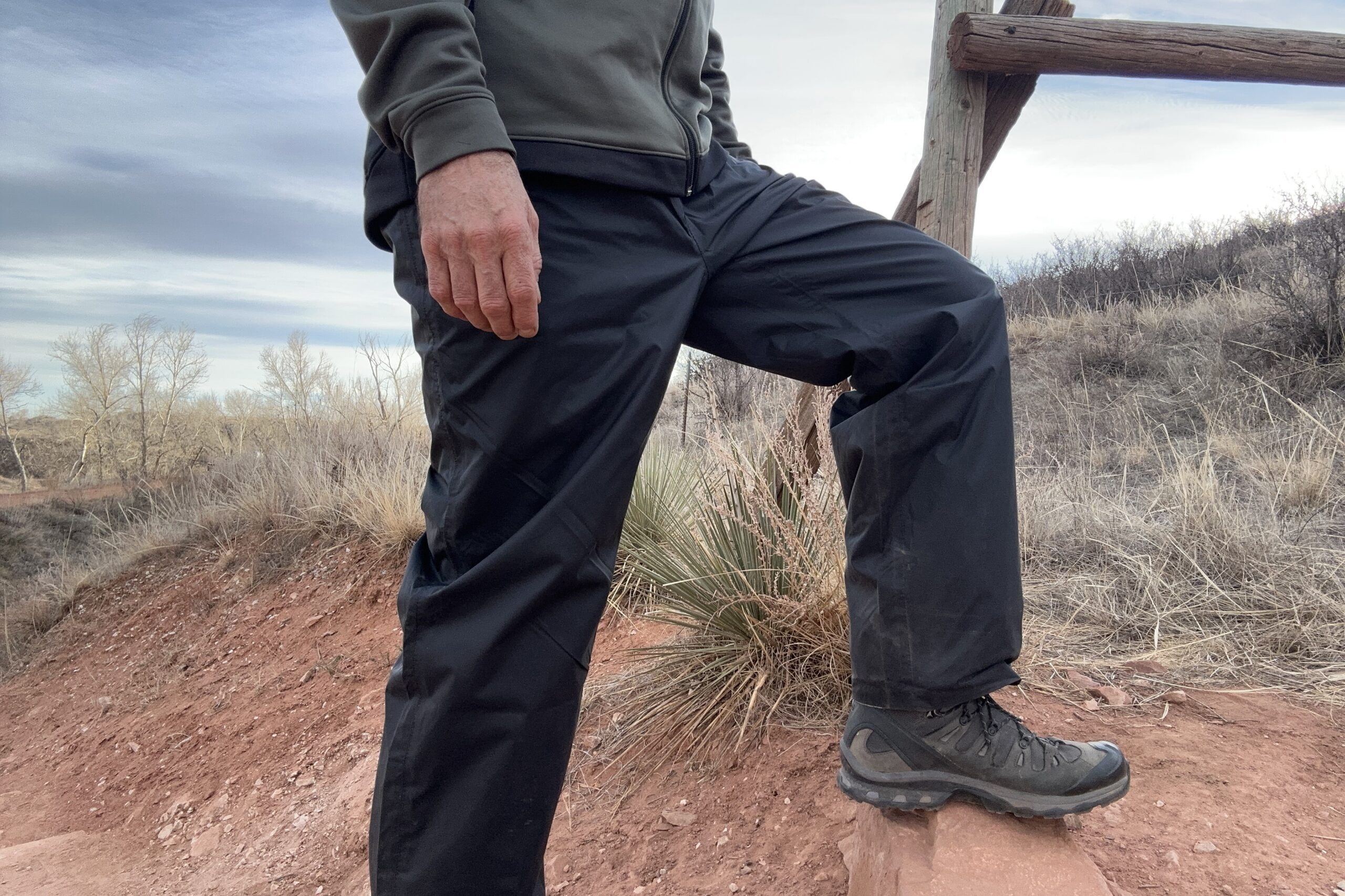 Image of someone wearing the black Columbia Rebel Roamer II on a trail.