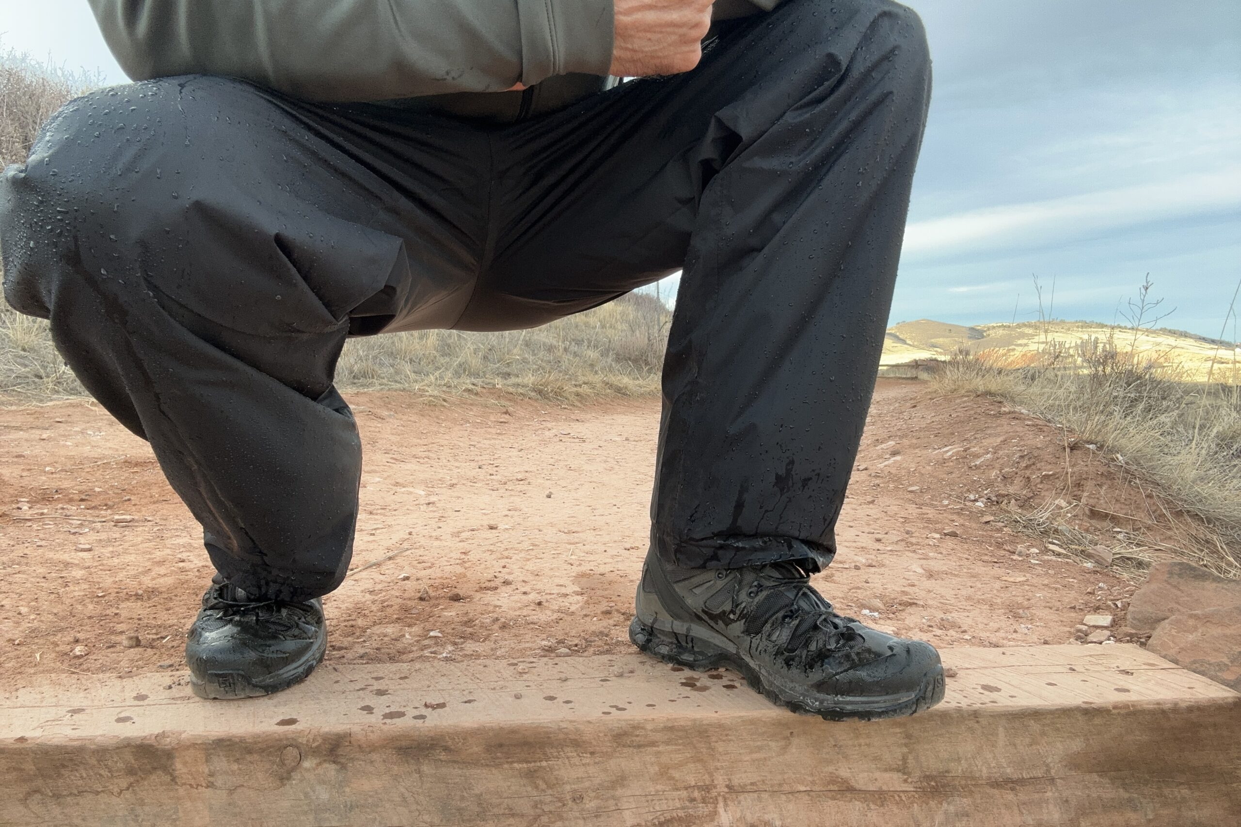 Image of someone wearing the black Columbia Rebel Roamer II on a trail.