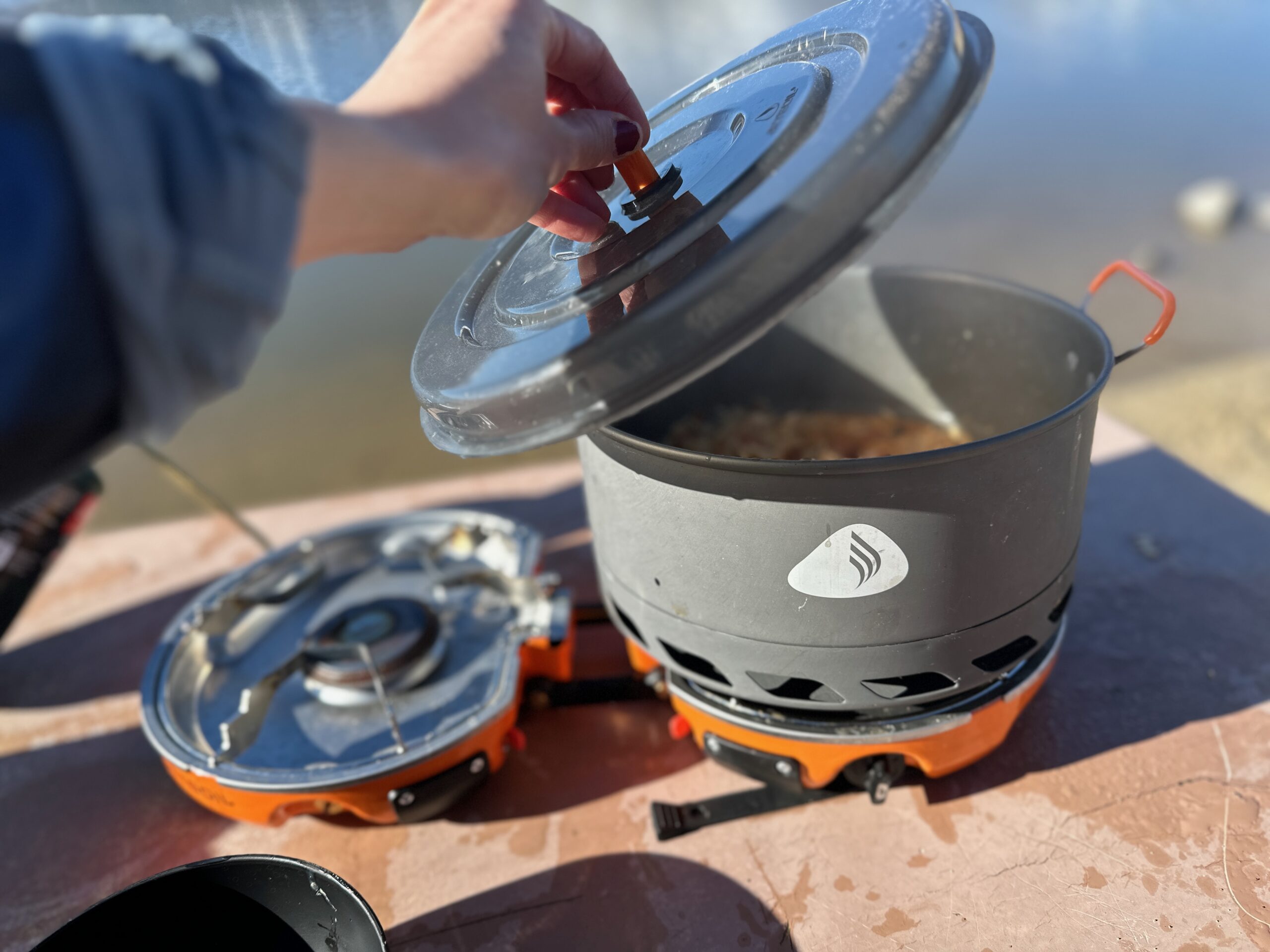 Lifting the lid on the Jetboil Genesis Basecamp System at a beachside campsite