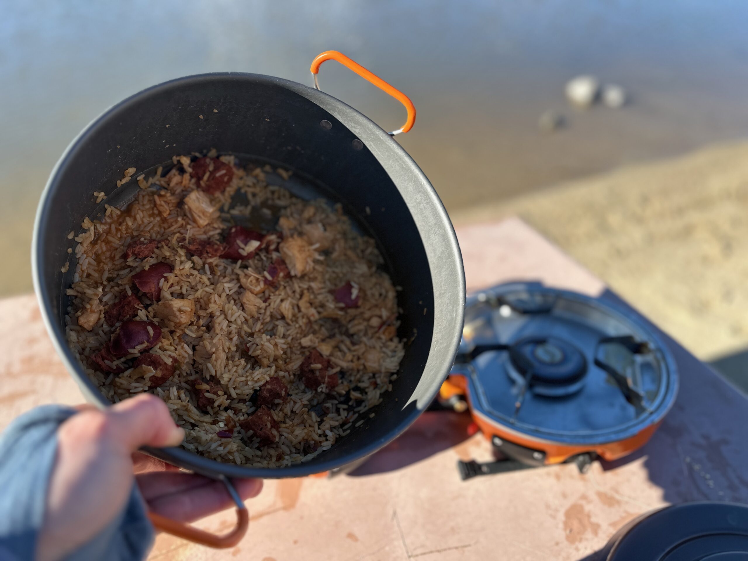 Showing off how well the Jetboil Genesis Basecamp System cooked a pot of rice