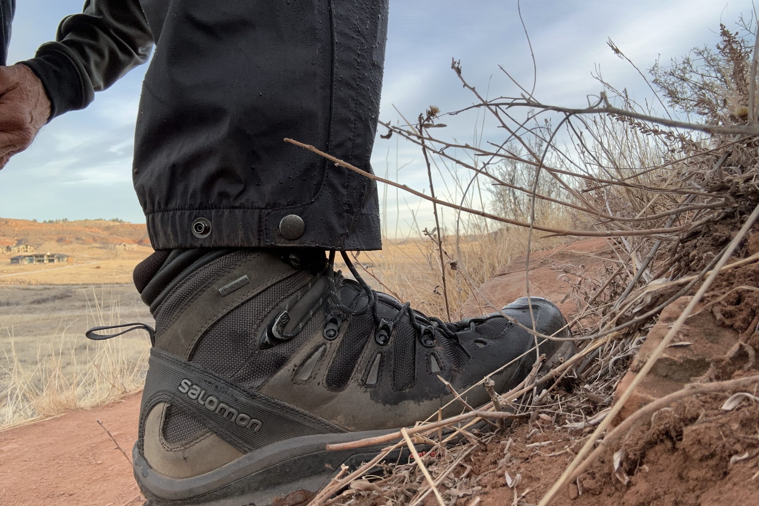 Closeup of the cuff of the black Patagonia Torrentshell rain pants.