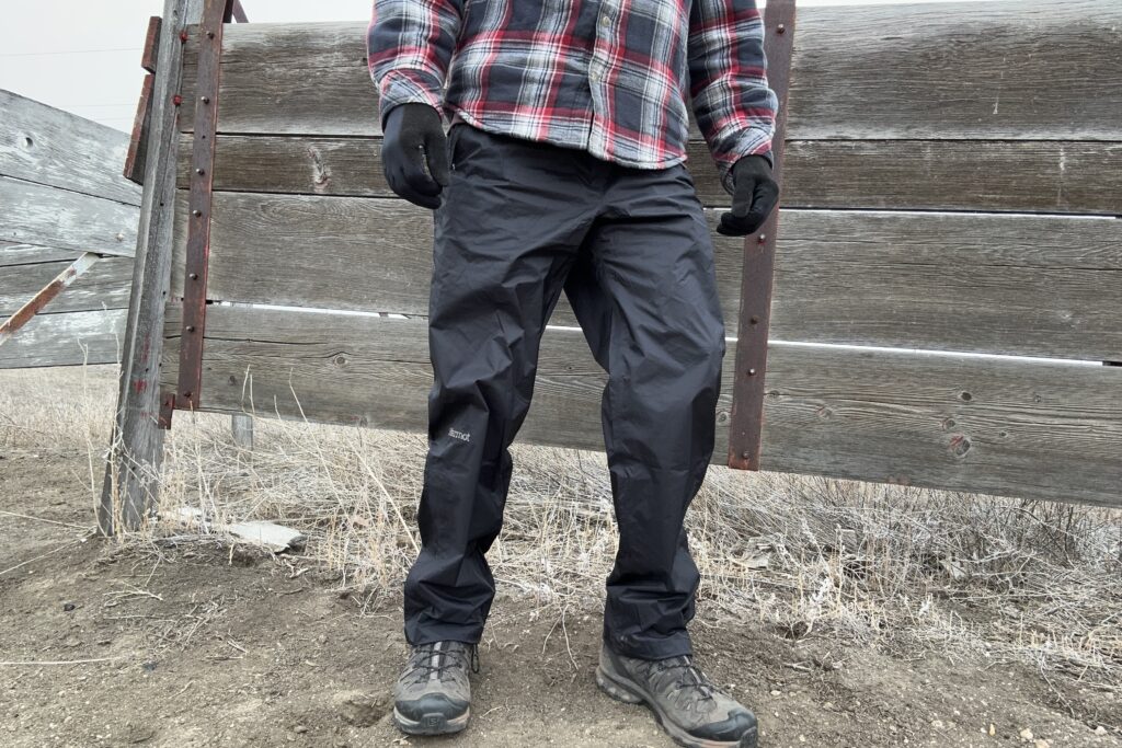 Image of someone wearing the black Marmot PreCip Eco rain pants.