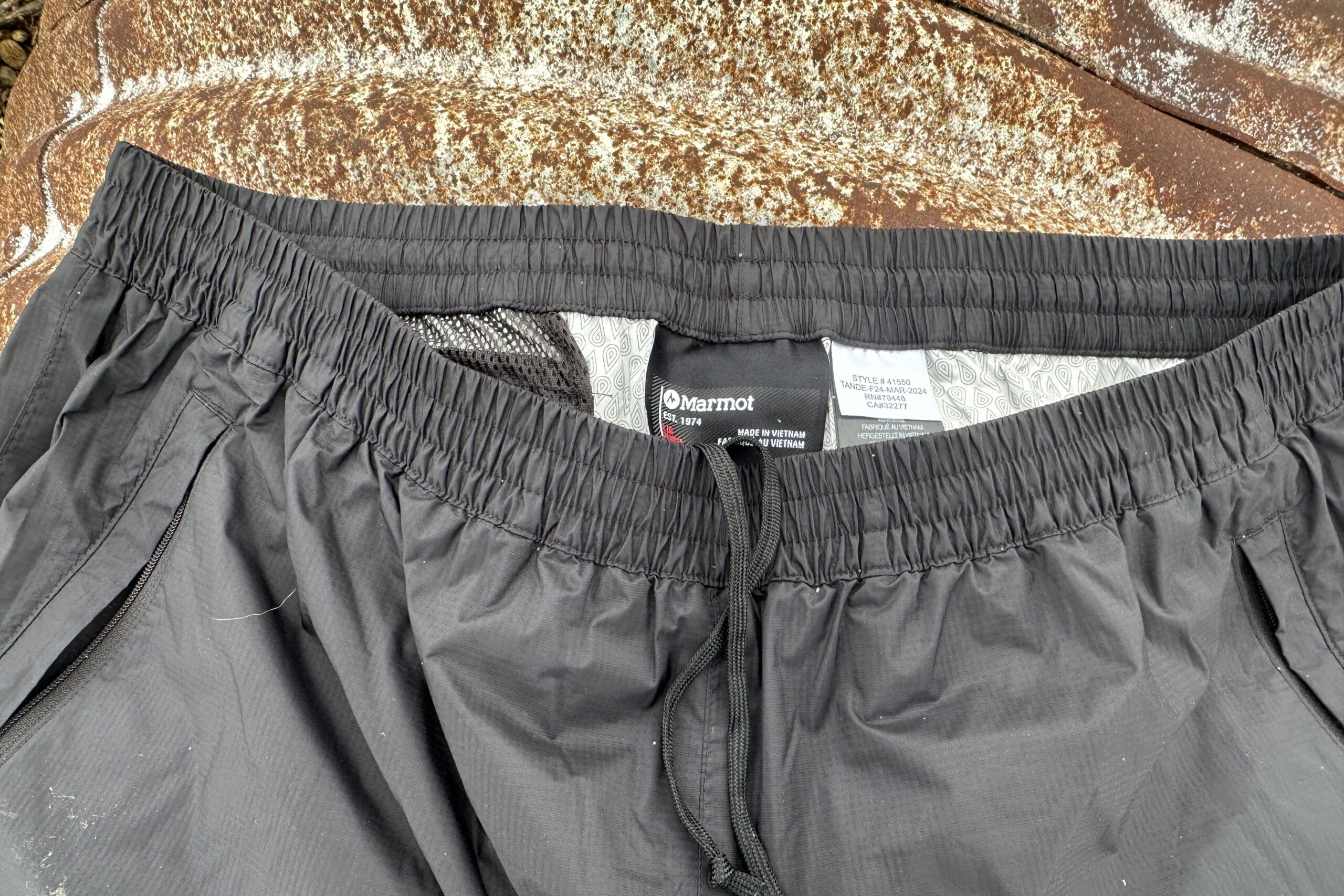 loseup of the waistband of the black Marmot PreCip Eco rain pants.