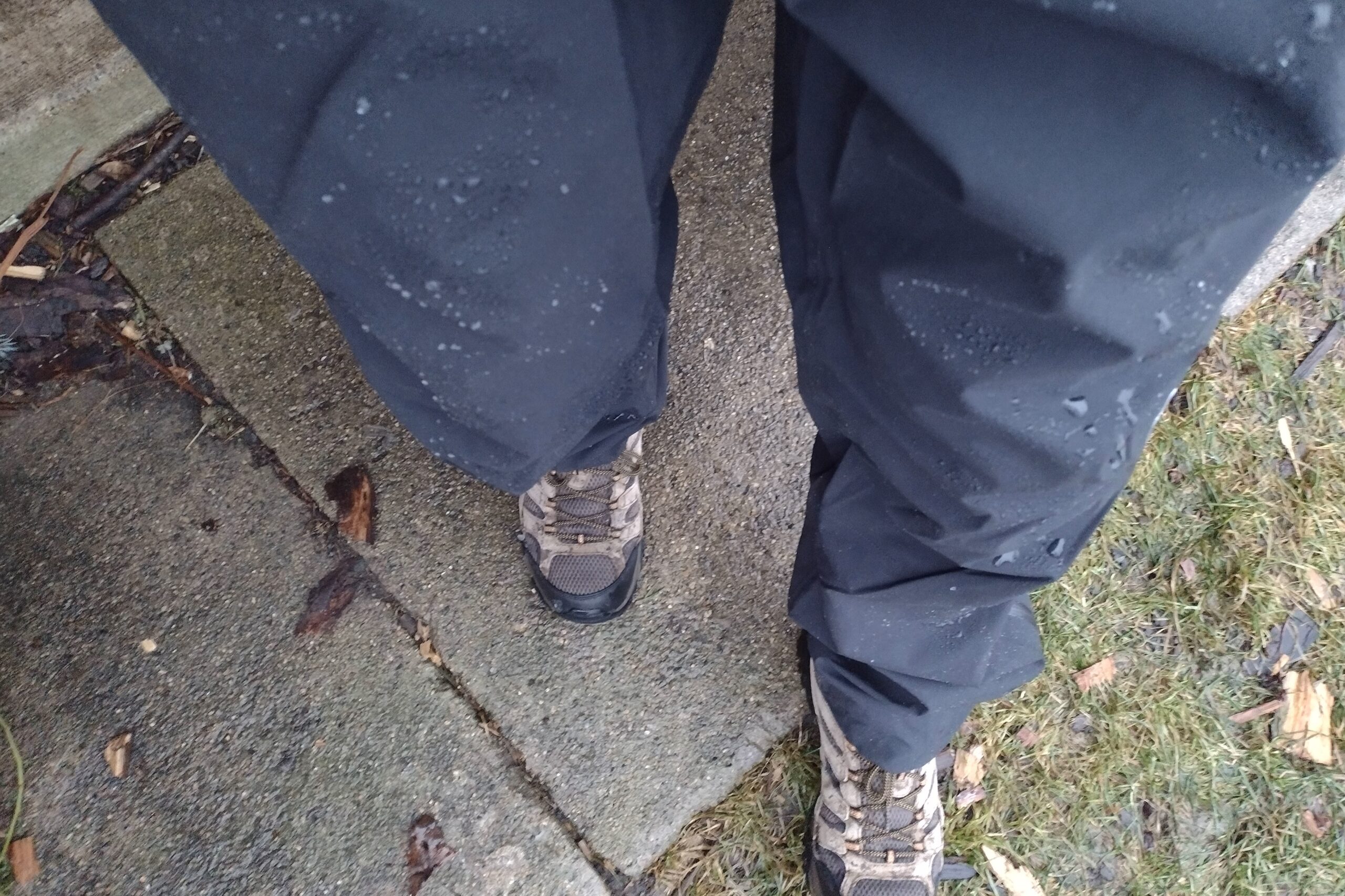 Closeup of someone wearing the Outdoor Research Foray pants on a snowy trail.