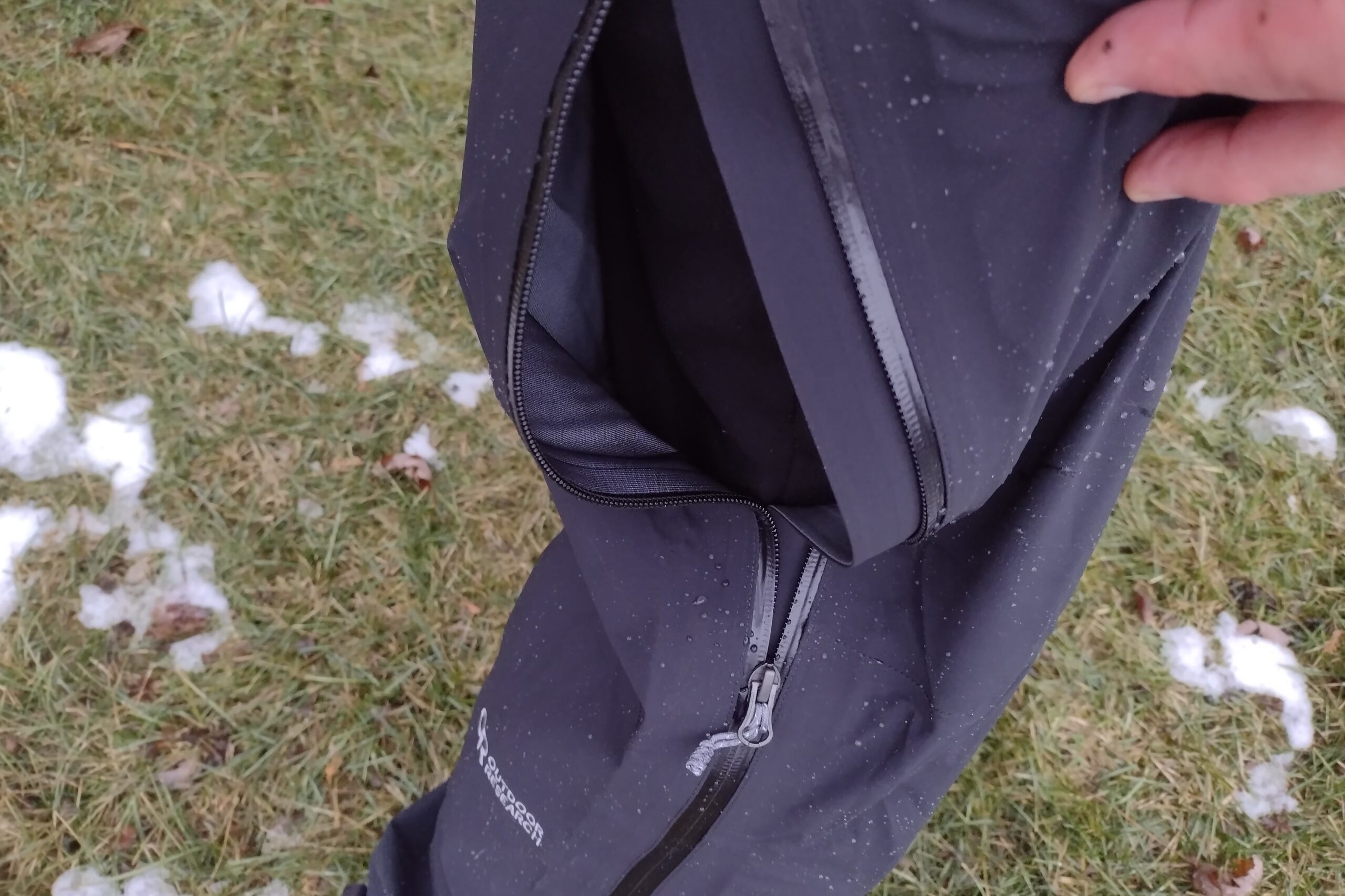 Closeup of someone wearing the Outdoor Research Foray pants, with a side zipper open.