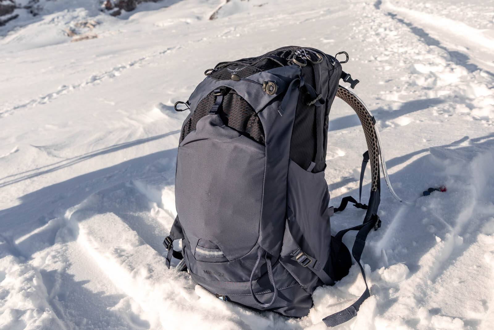 Details of Osprey Mira 22 - Pack is sitting on snow on a sunny day