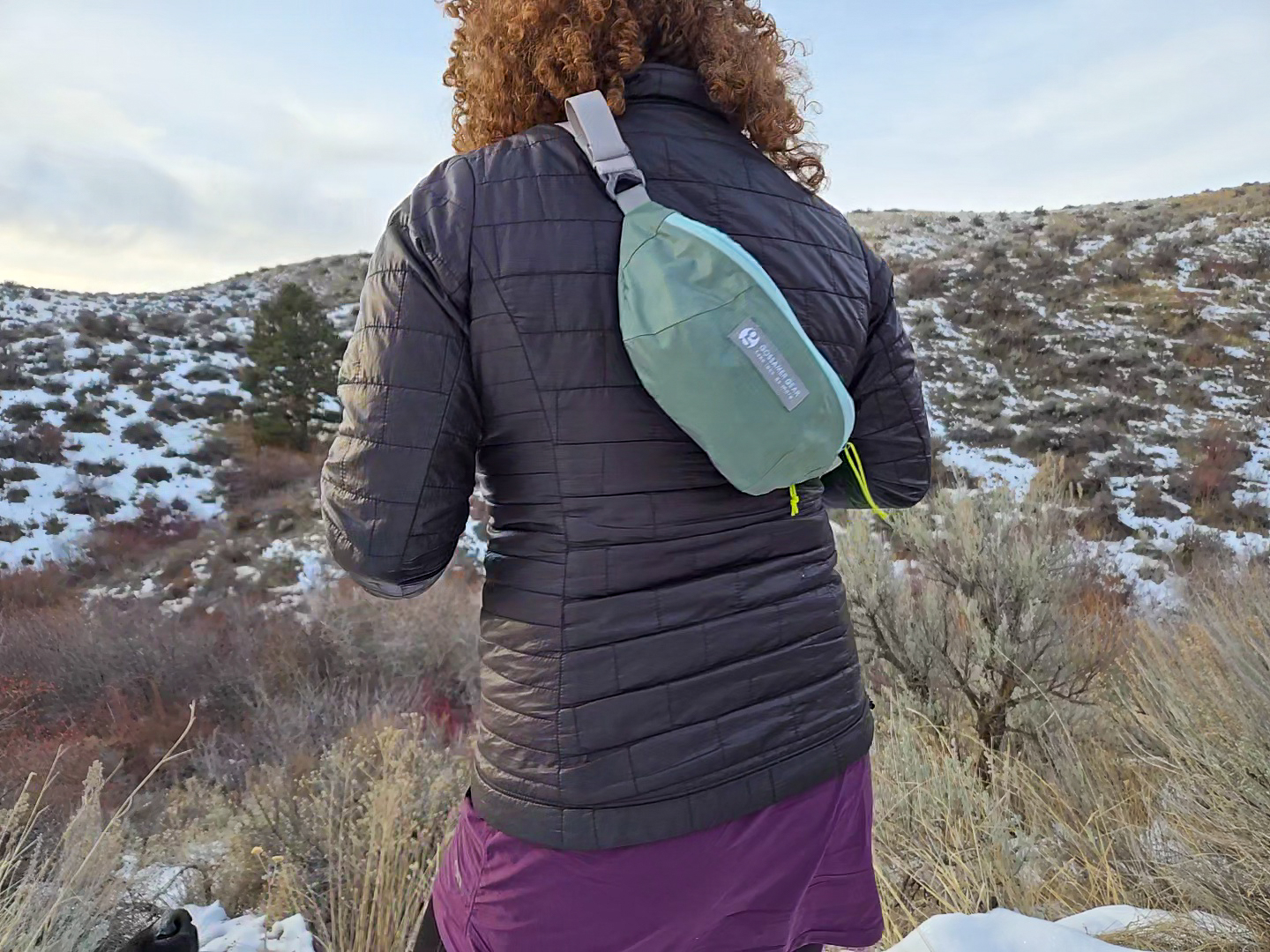 woman's back with the gossamer gear bumster slung over her shoulder