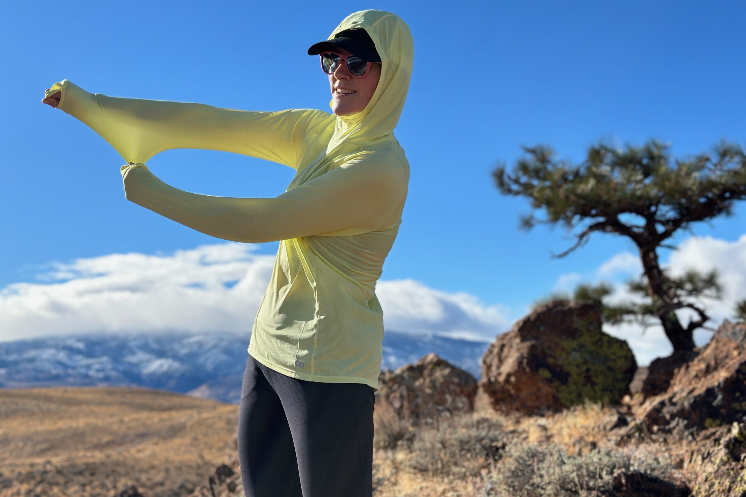 woman hiking with pack on in high desert landscape